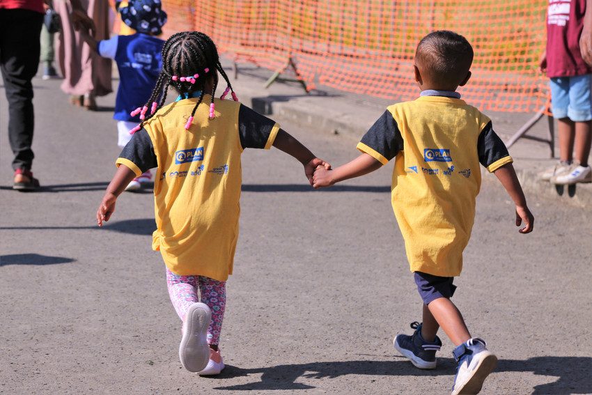 Children in Ethiopia hold hands