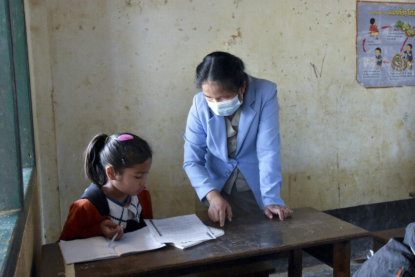 Girl and teacher in Laos