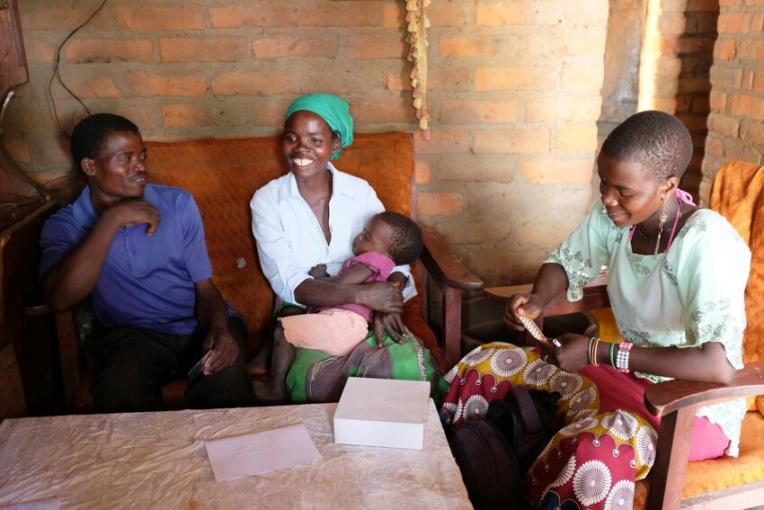 Nester discusses contraceptive options with a young couple.