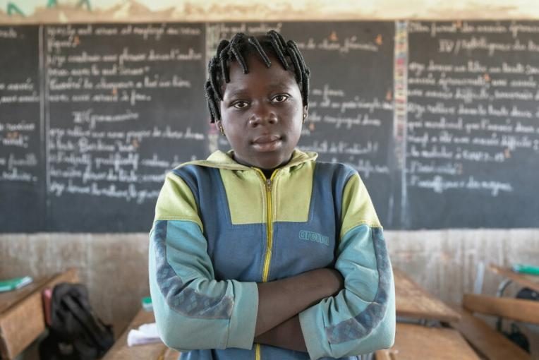 Conflict and COVID-19 have forced schools to close in Burkina Faso, halting the education of girls like Rosine.
