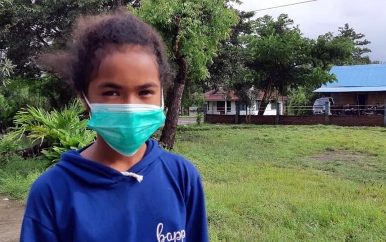 Ervin, 11, has been sleeping on the bare floor since the flash floods hit.