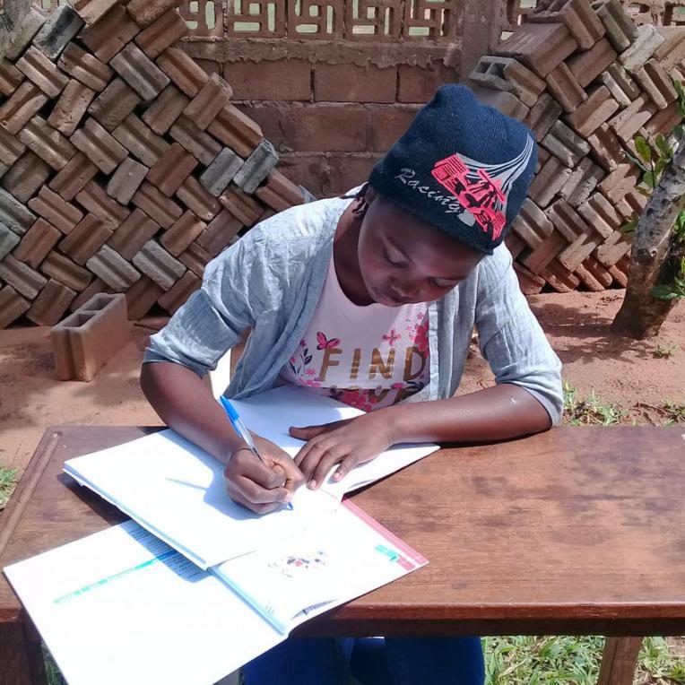 Raina, 12, from Mozambique has been learning at home since her school closed due to COVID-19.