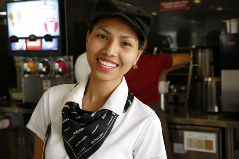 Emily working at a fast food chain in Tacloban
