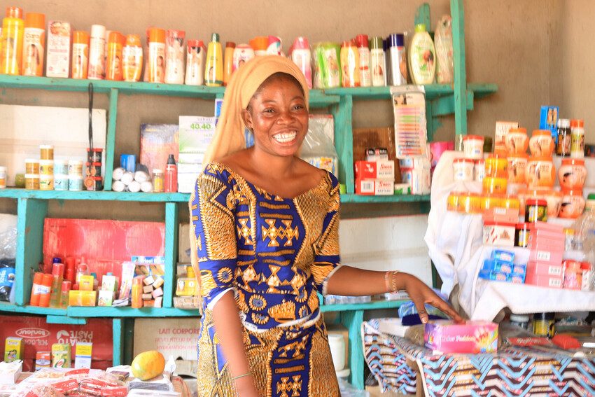 Wakila, 23, in the cosmetics shop she set up with a savings group loan.