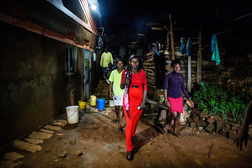 Faridah leads a group of girls through the streets of Kampala to assess and map the risks to their safety.