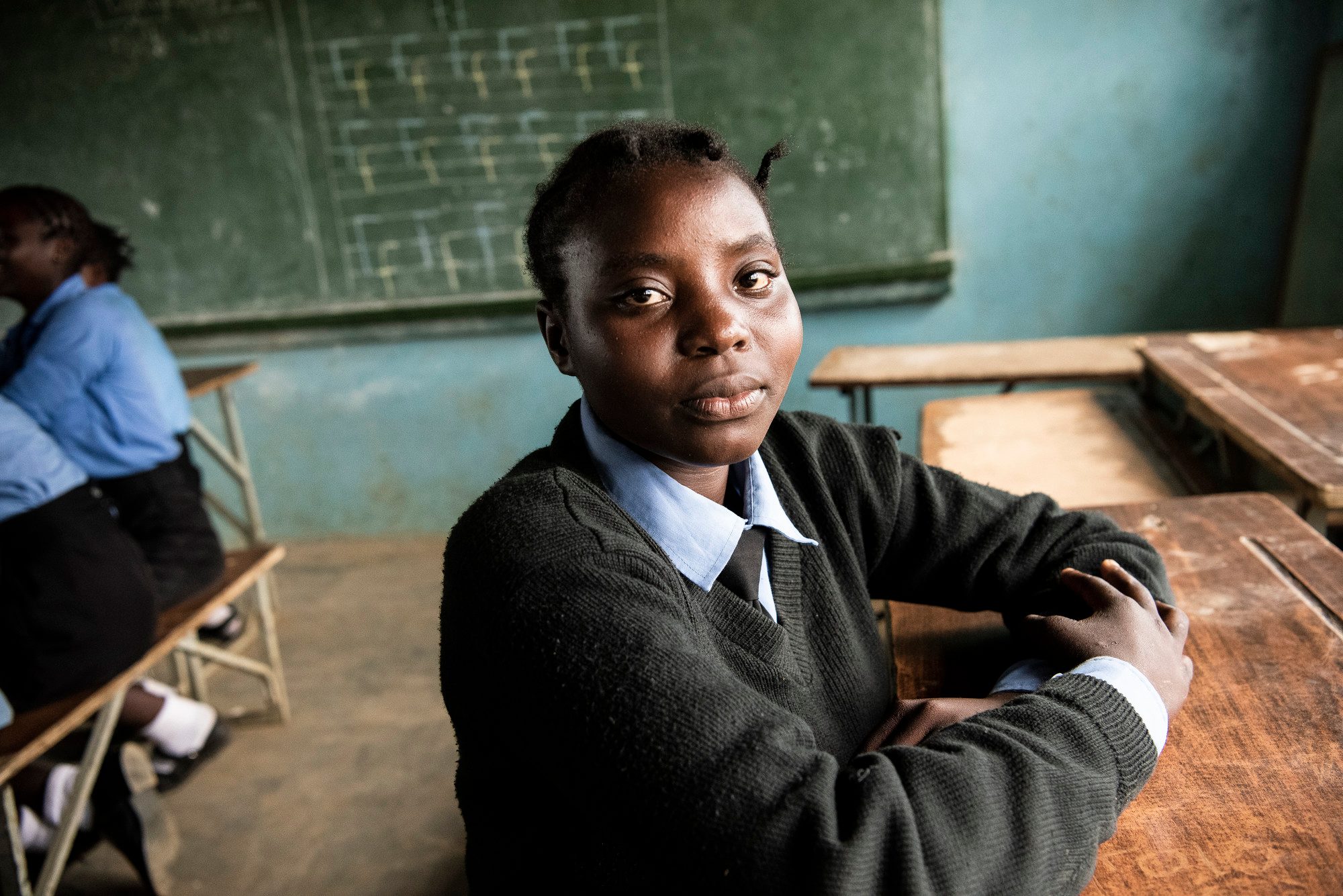 Girl sat in a classroom