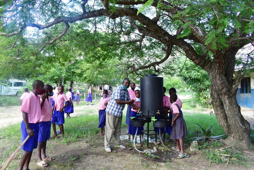 Children use a water point installed by Plan International at a school in Kwale county, Kenya.