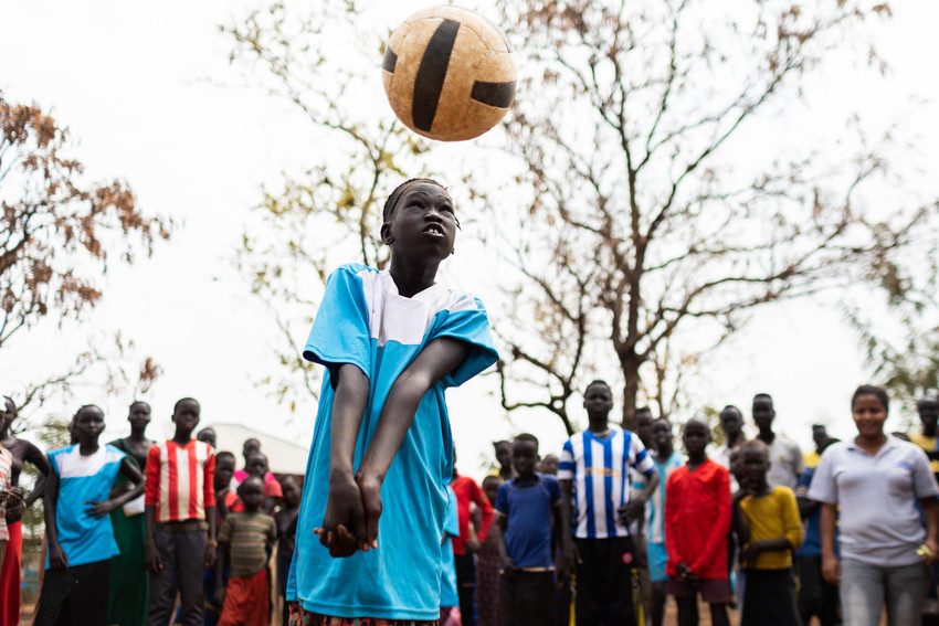 Nya Bahn, 12, originally from South Sudan, plays volleyball at a child-friendly space in a refugee camp in Ethiopia.