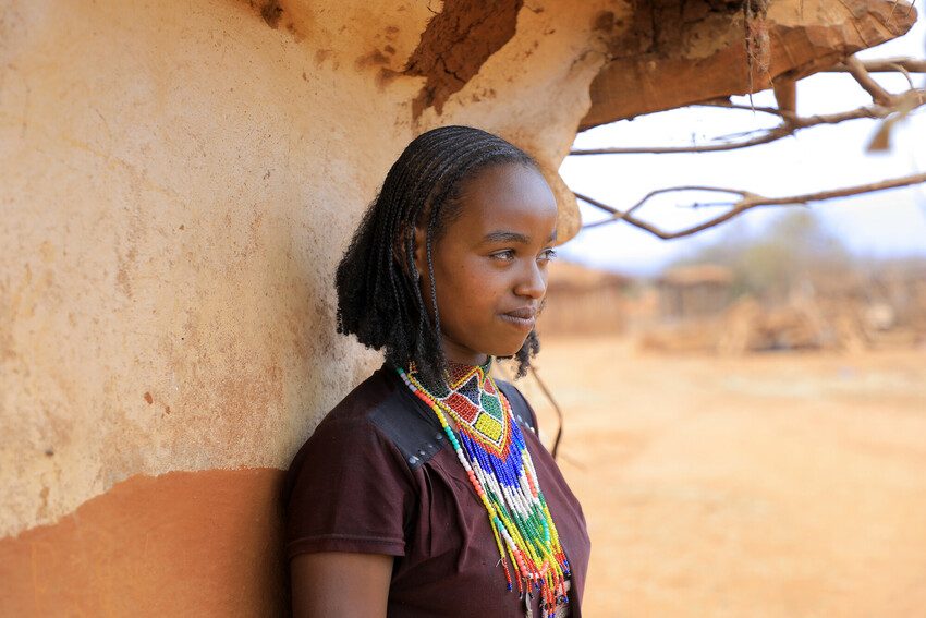 Loko, 18, has to collect and sell firewood to buy food.