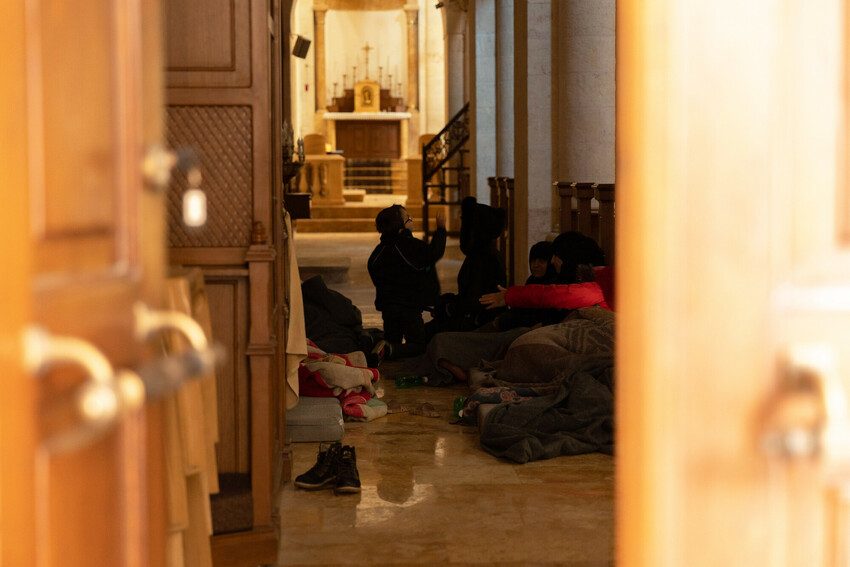 Families sheltering in church in Aleppo.