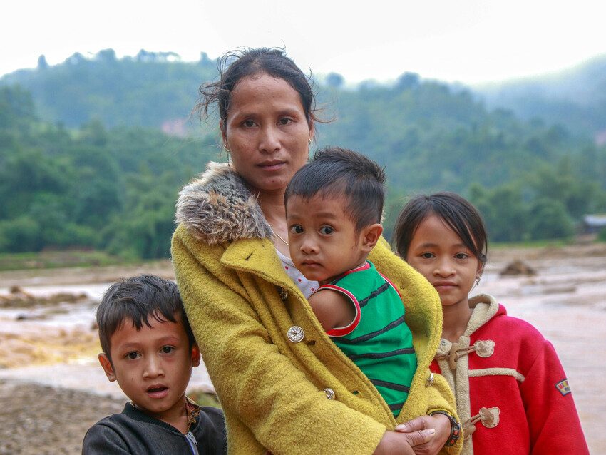 Ly, 32, with her three children. Her livelihood was destroyed by floods in Vietnam.