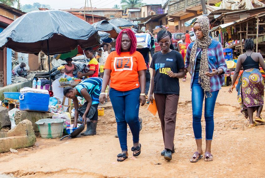 Blessing, 17 (middle) and her co-campaigners assess the safety of girls and young women in Freetown, Sierra Leone.