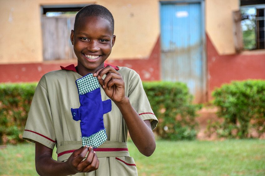 Zarinah, 15, with one of the reusable sanitary pads she has made.