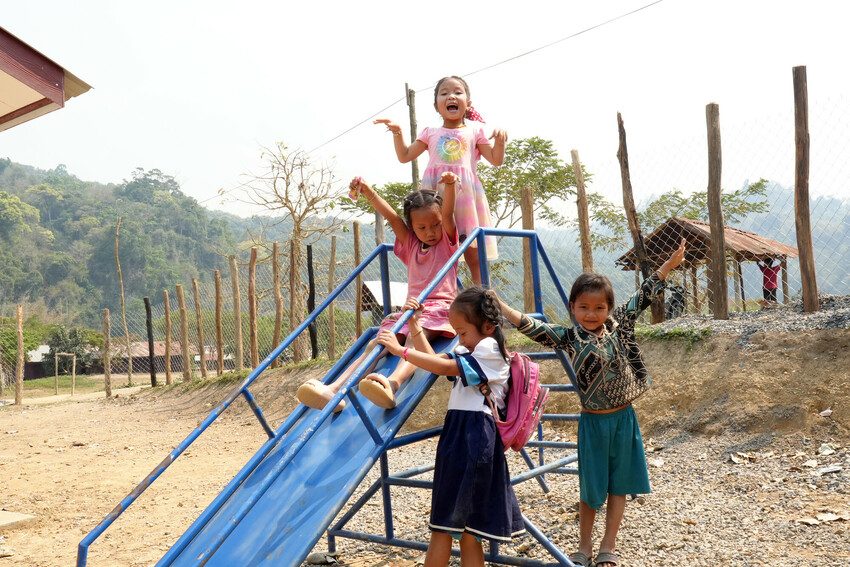 Children at the pre-school enjoy their new outdoor play area.