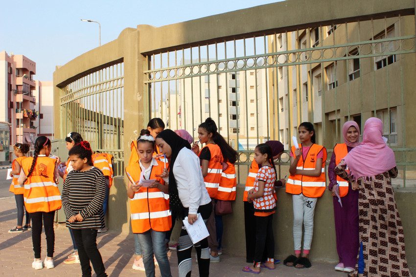 Girls take part in safety walk in a Cairo suburb.
