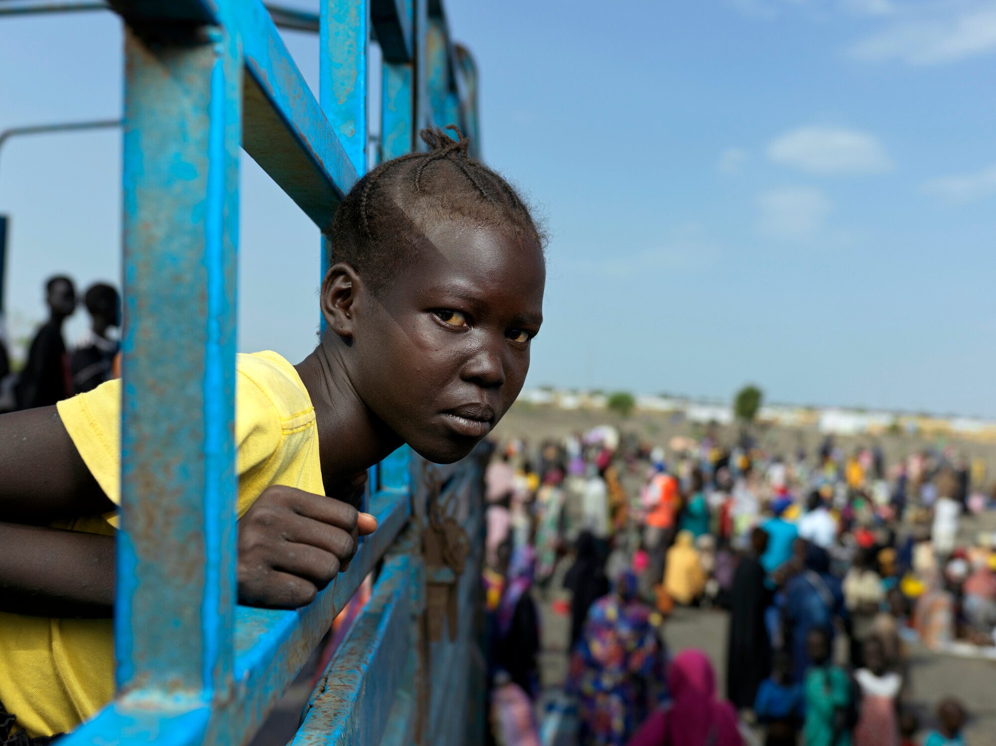 Hiteta, 14, on a truck that will transport her and her family to Renk transit centre.