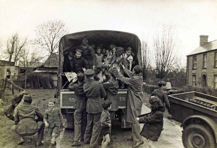 The children in the back of the army truck. Black and white photo 1944. 