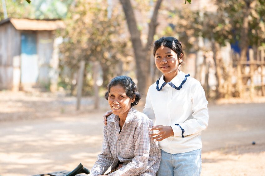 Grandmother Bui Non, 57,  and her teenage granddaughter Seila, 13, Cambodia.