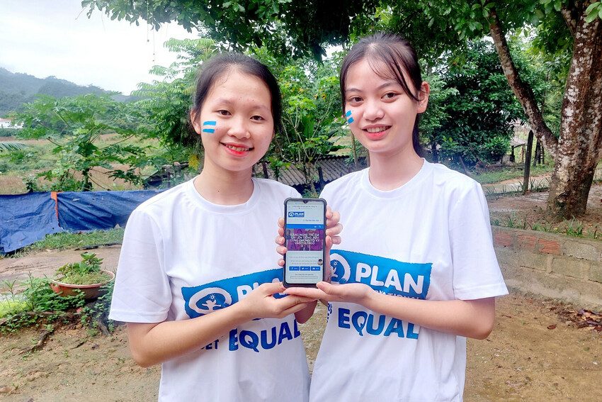 Girls in Vietnam sign online petition calling for children to be educated in digital literacy. 