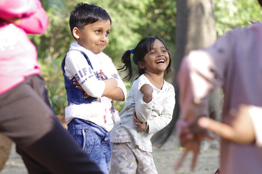 Children enjoy outdoor learning activity in Delhi.