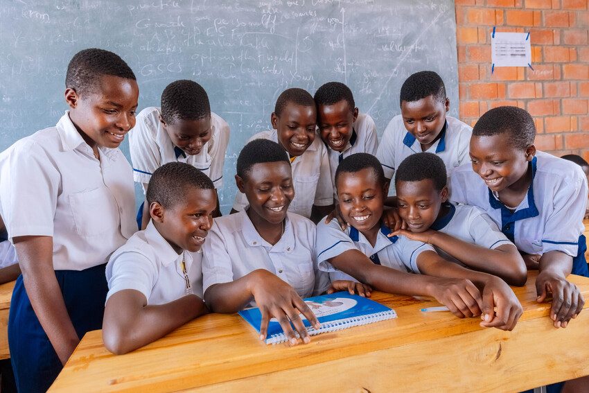 Esther, 18, is sitting with a group of girls teaching them about CSE. 