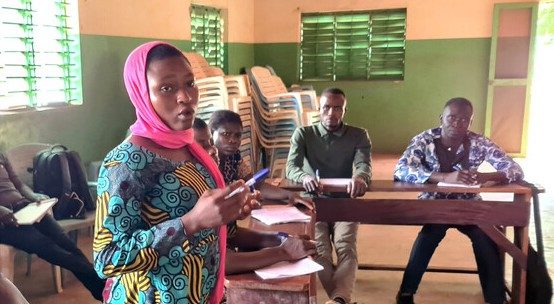Sonia in Togo speaking to the room during a peer education session. 