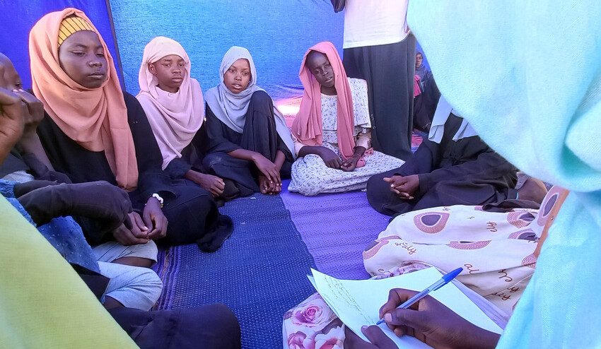Girls take part in activity at mobile child protection unit in Adre camp.