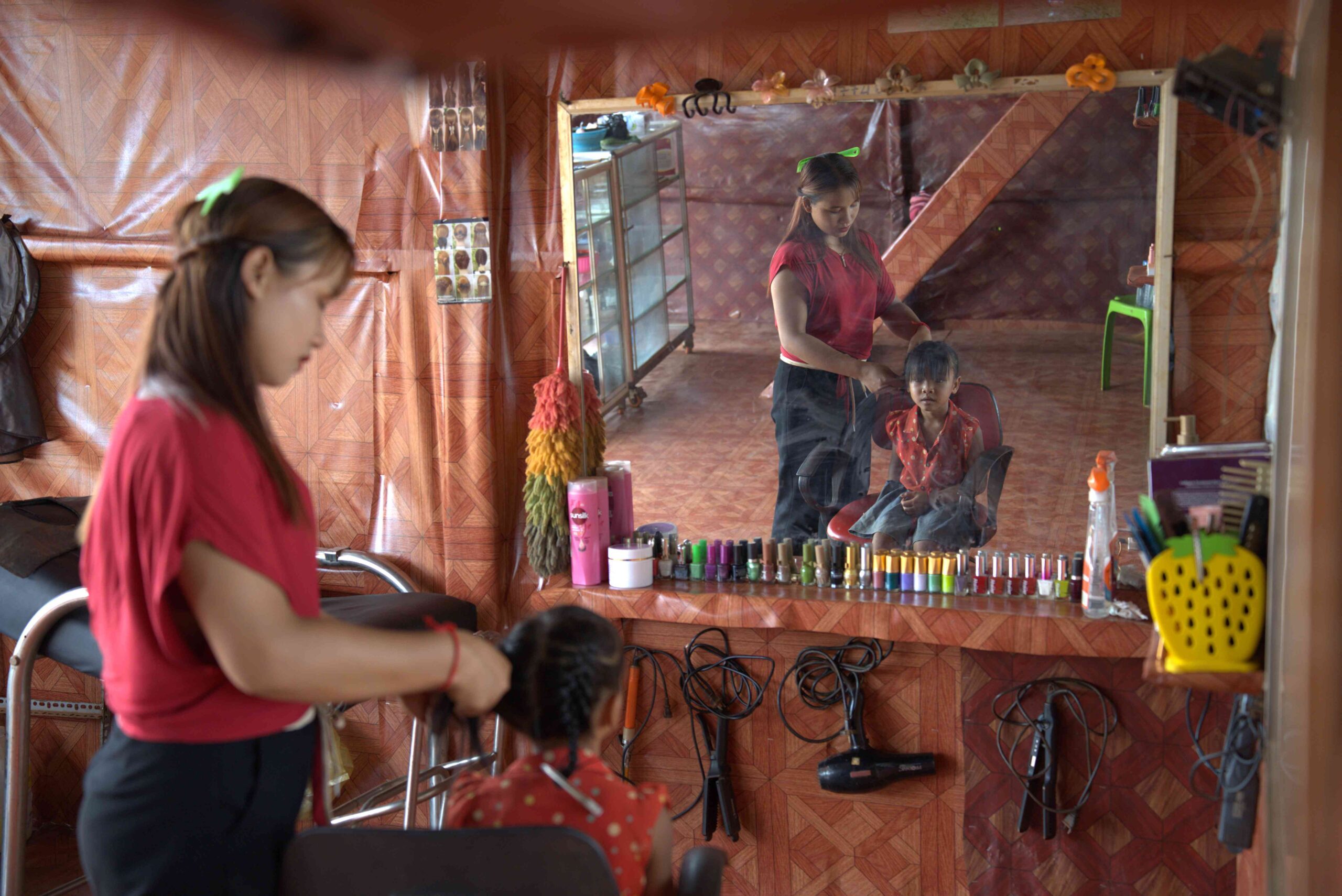 Pov braiding a young girl's hair.