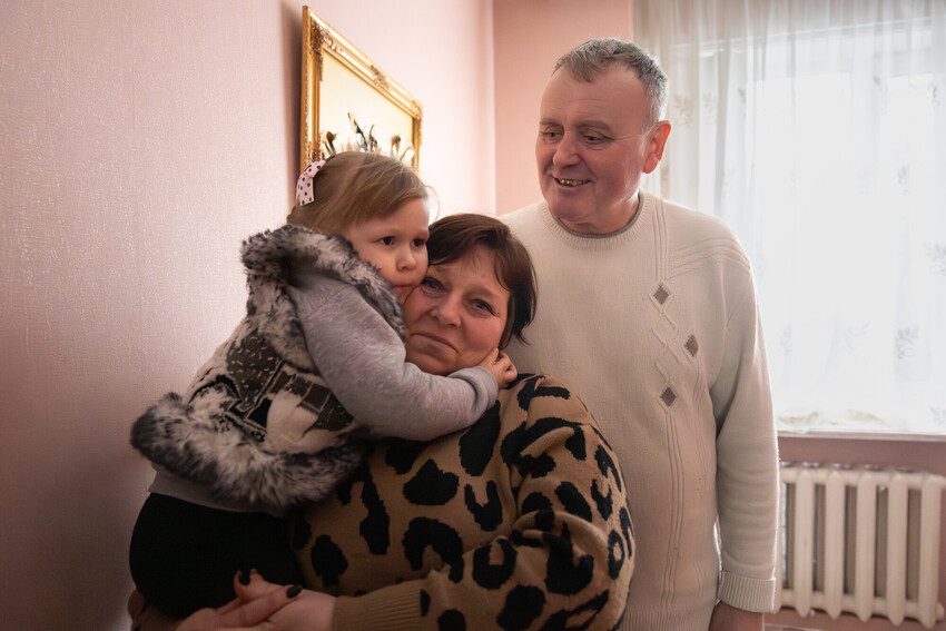 Yuri, 54 and Nadia, 49, with one of their foster children, Valeria, 3.