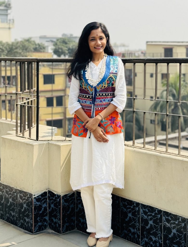 Neha standing smiling