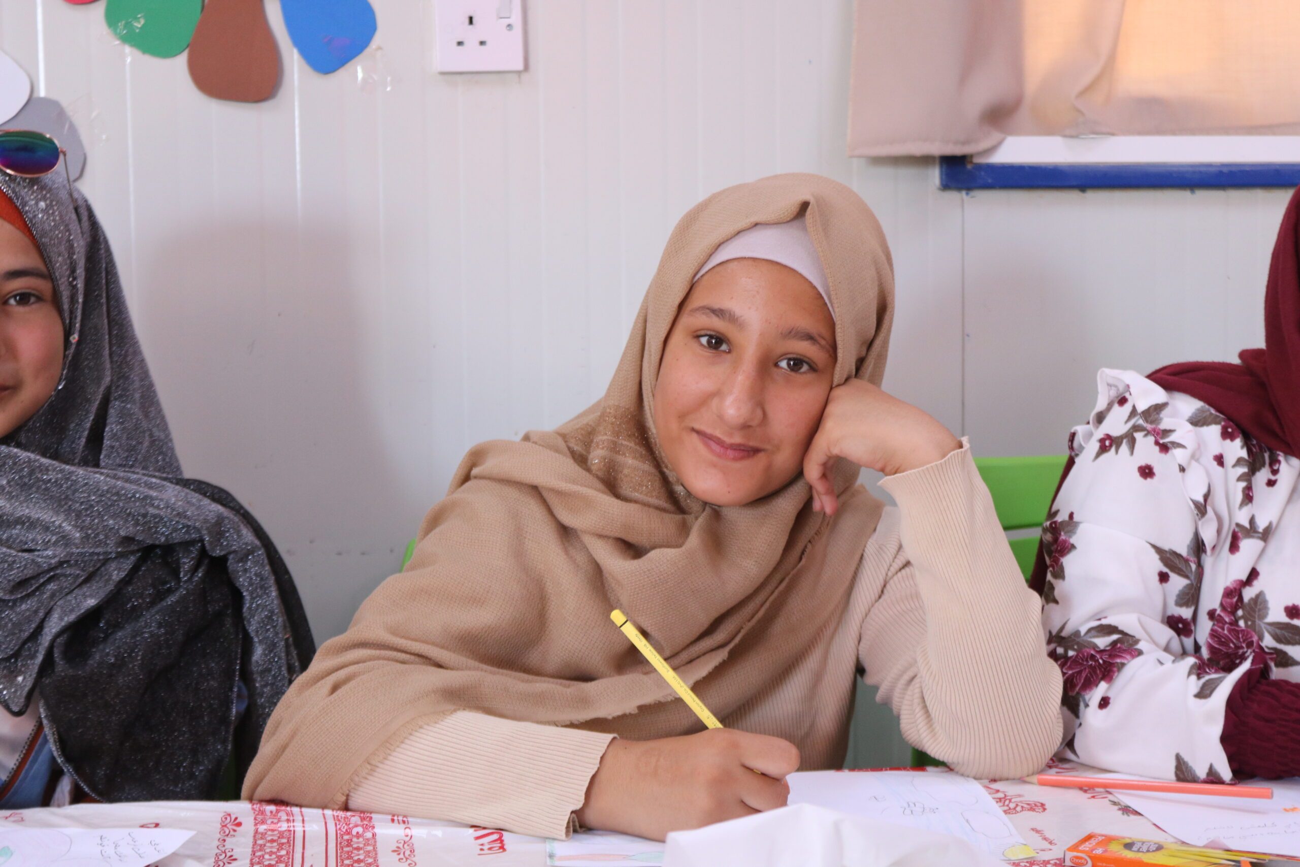 An adolescent girl attending an Arabic lesson