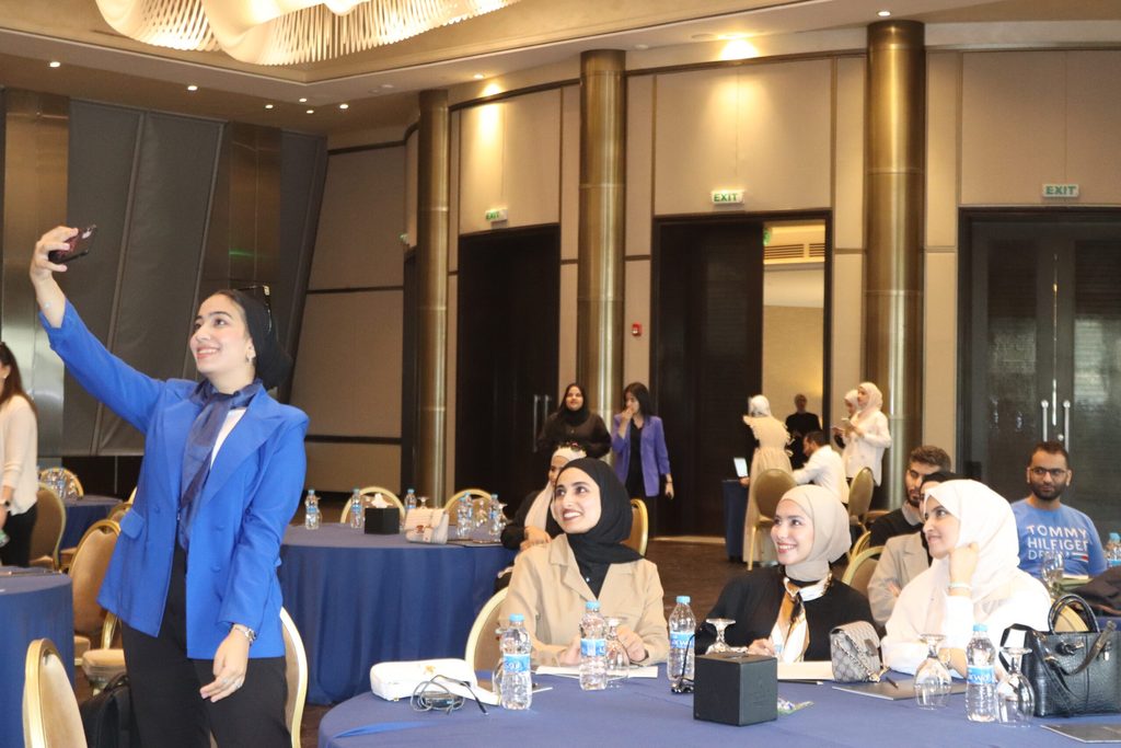 Group of young girls taking a selfie photo at the event.