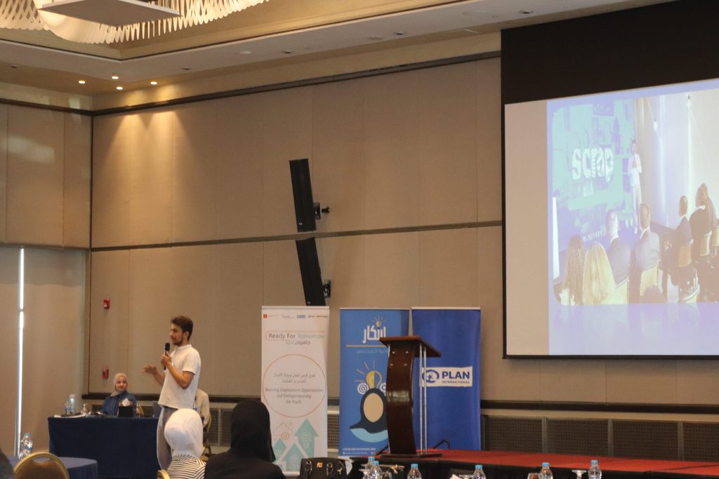 Ahmad speaking at an event hosted by Plan Jordan to celebrate International Youth Day 2024.
