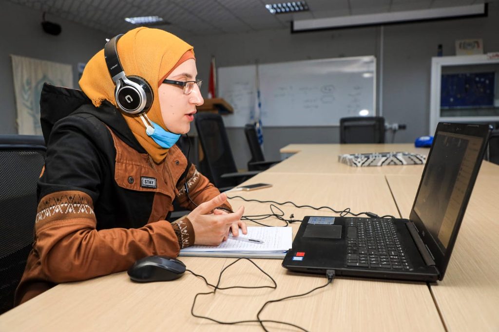 Alaa Al-Qasem, doing a report as part of her job as a journalist.