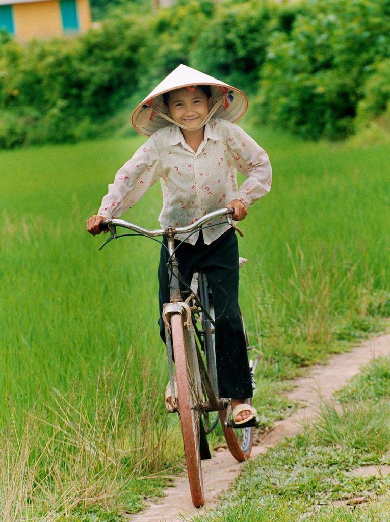 A girl riding her bike in Vietnam