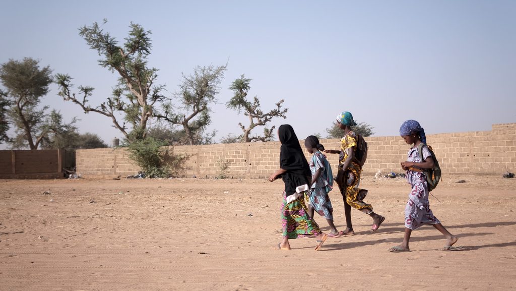 Salimata, 12, is on her way to school with her friends.