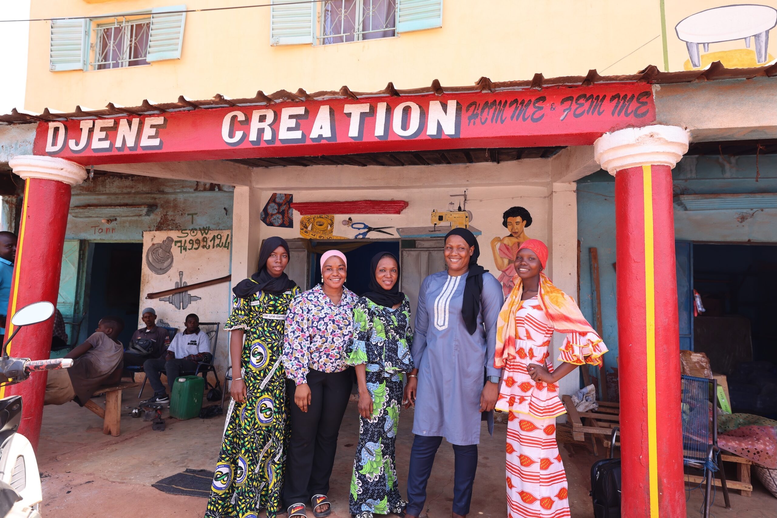 View of Djeneba and her staff standing front of the shop