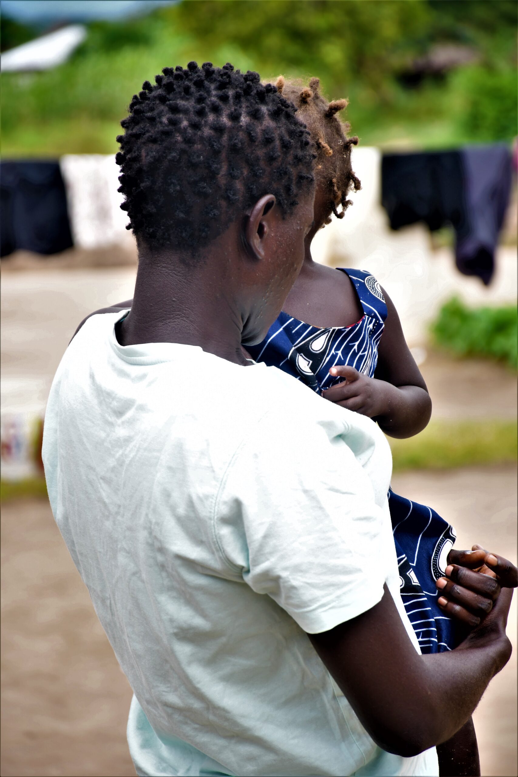 A mother holding her daughter in Uganda