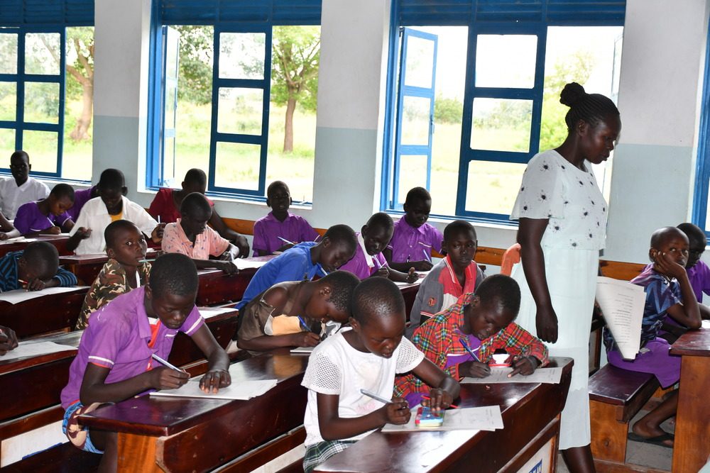 Children learning in a classroom in Uganda