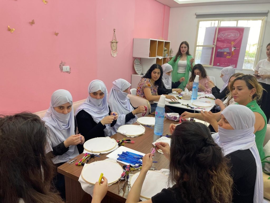 Girls and young women attending a workshop.