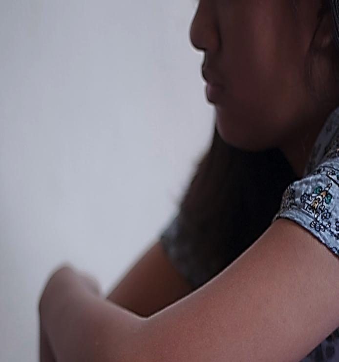 A close-up shot of a girl sitting