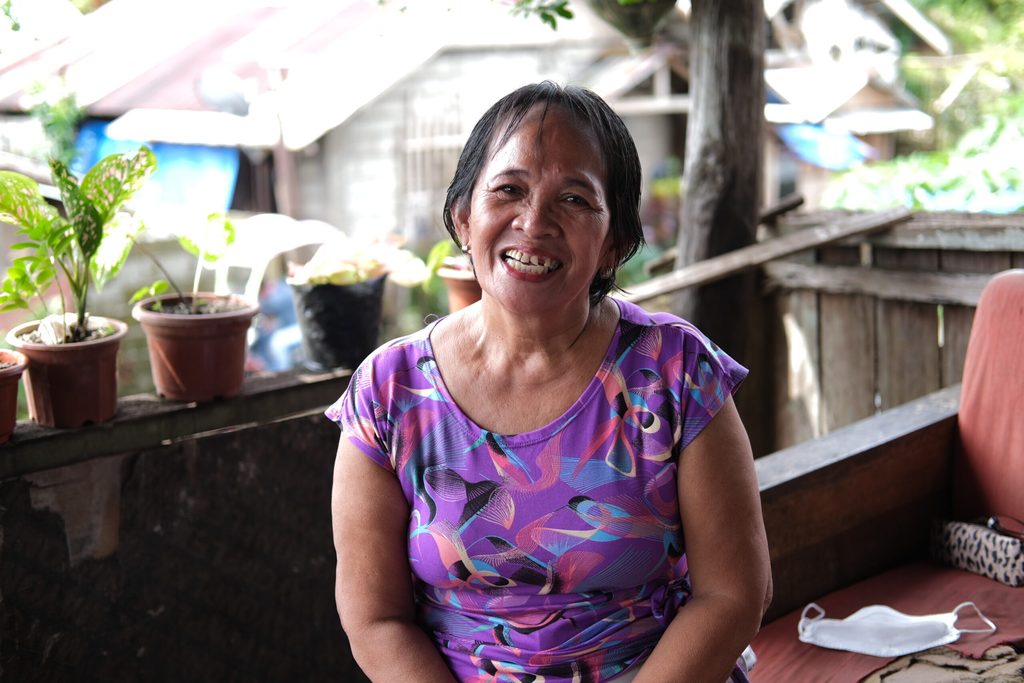 Ermelinda smiles at the camera during the interview. 