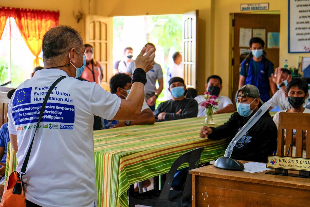Plan International’s project manager in Southern Leyte shares a few words during one of the carpentry training sessions