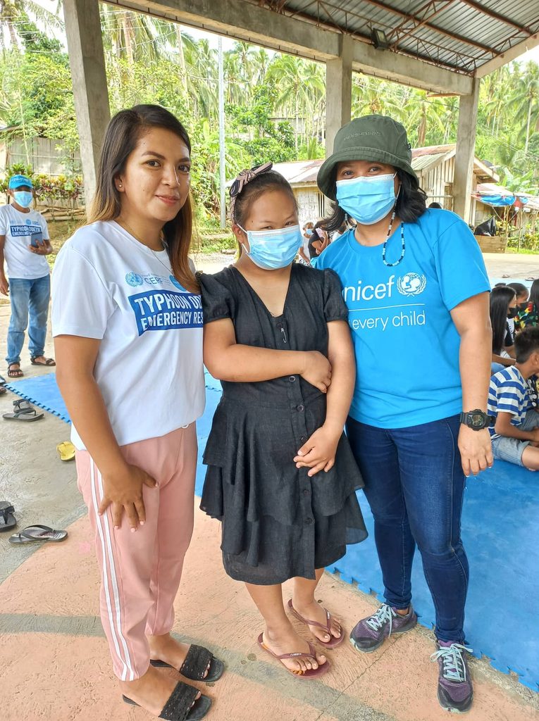 Angelie with one of the youths participating in  the Child-Friendly Space in their community 