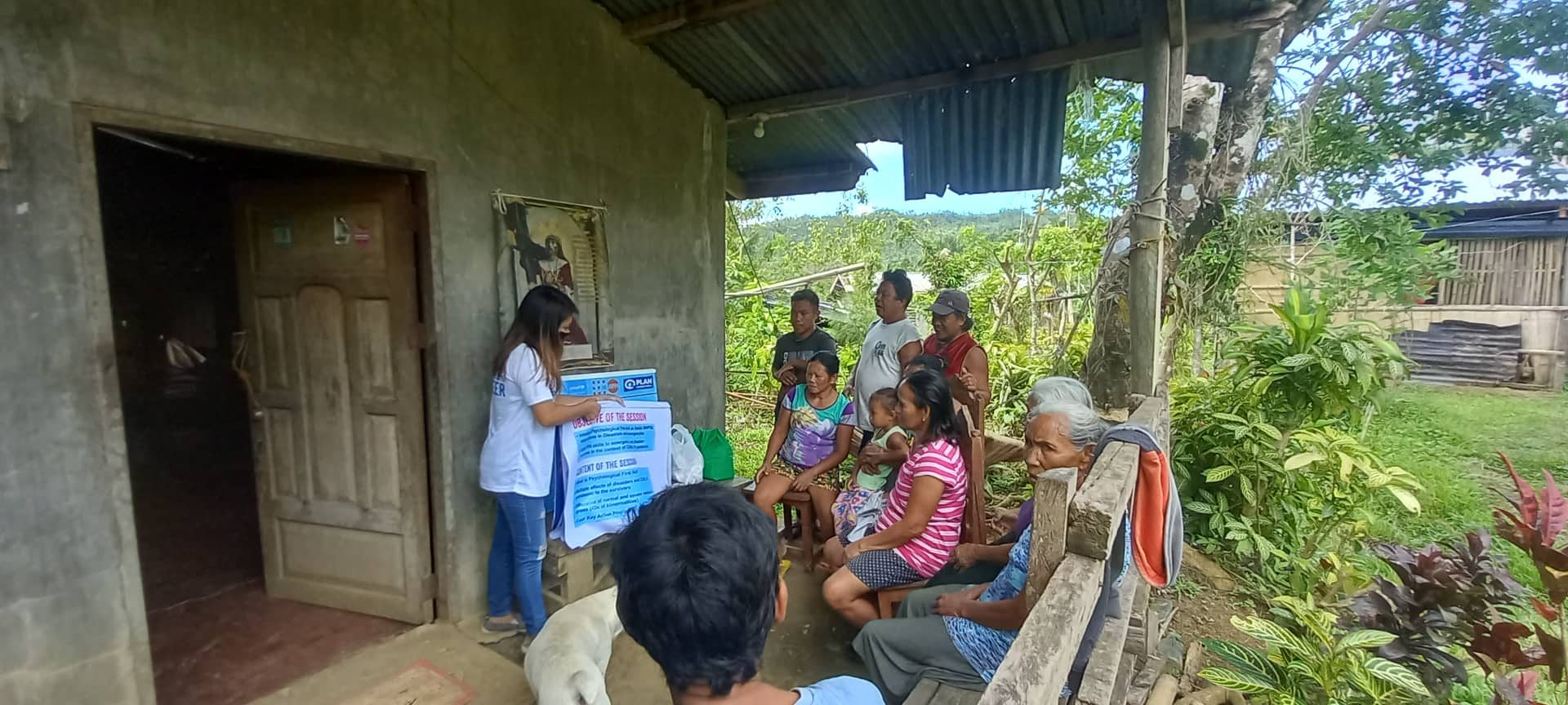 Angelie conducting house-to-house visits in her community