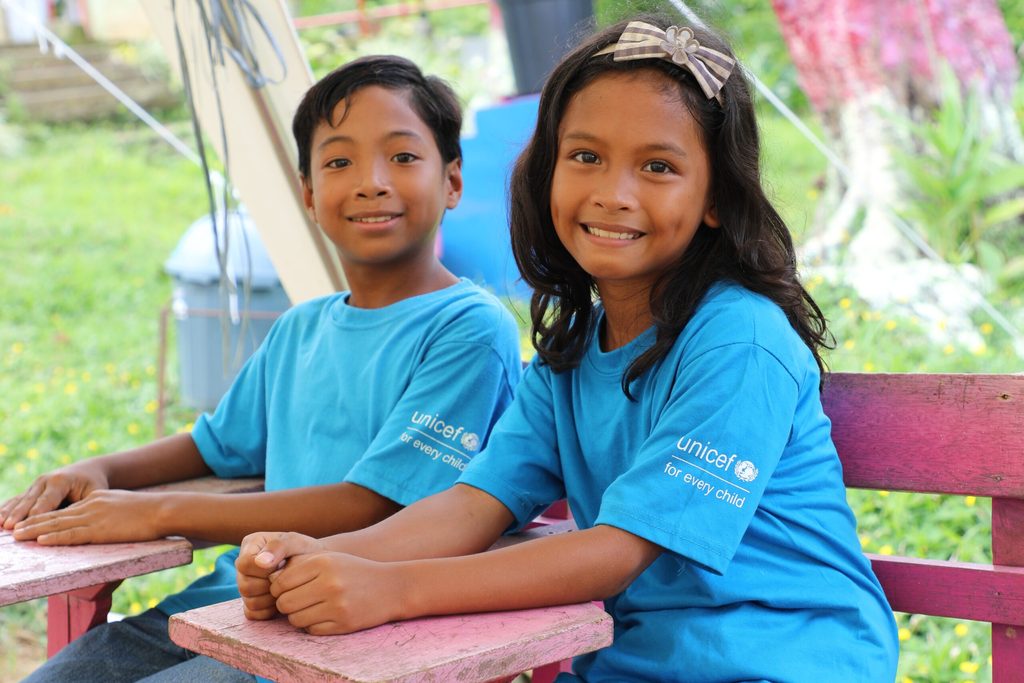 Elementary students wearing the UNICEF shirts included in their Learner Kits 