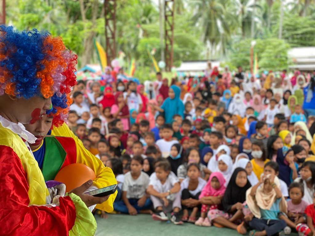 Party clowns entertain the sponsored children and families in Datu Odin Sinsuat