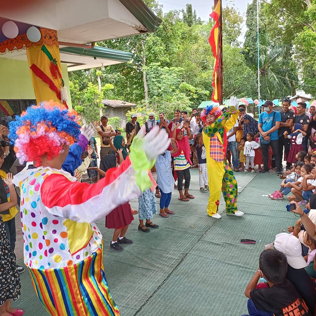 Party clowns entertain the sponsored children and families in Datu Odin Sinsuat