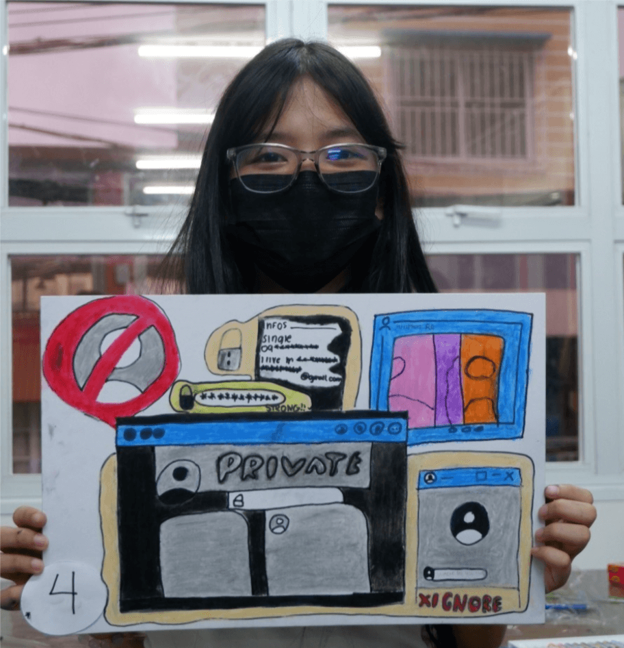 Coleen, 14 years old, one of the participants of slogan and poster making contest during the celebration of National Children’s Month on November 19, 2022. Coleen exhibits her work with an emphasis on the online safety tips for teens.