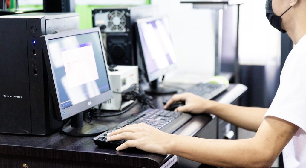 A boy uses a computer